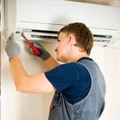 technician working on a ductless unit