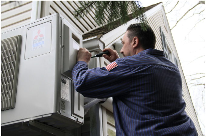 a technician working on a unit