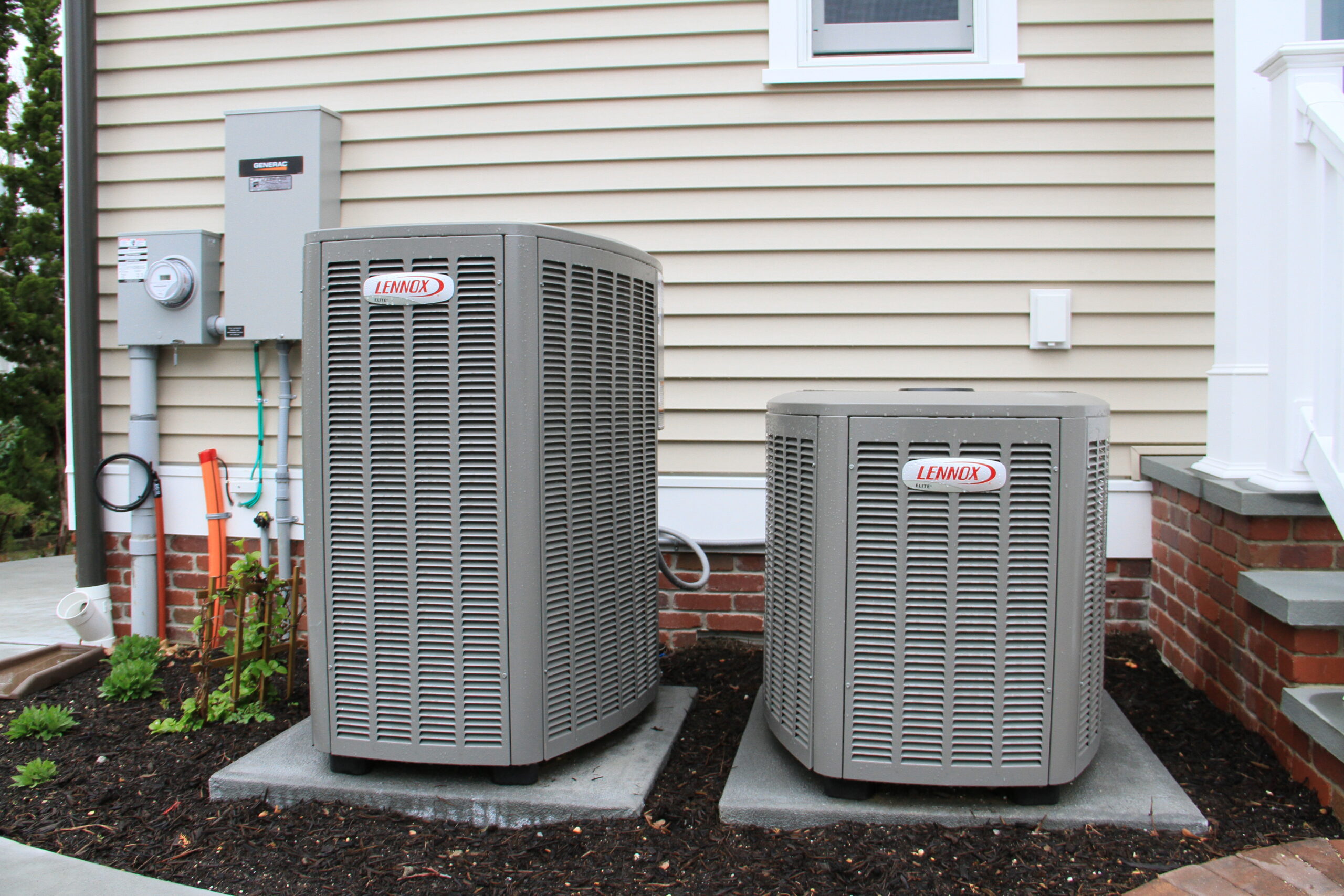 an image of 2 air conditioning units outside the house